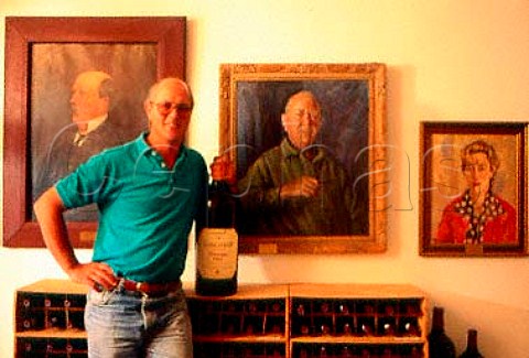 Kanonkop Estate coowner Johan Krige   with paintings of his great   grandfather grandfather and mother   Stellenbosch South Africa