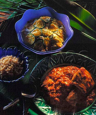 Fish in tomato and coconut sauce with baked   corgettes
