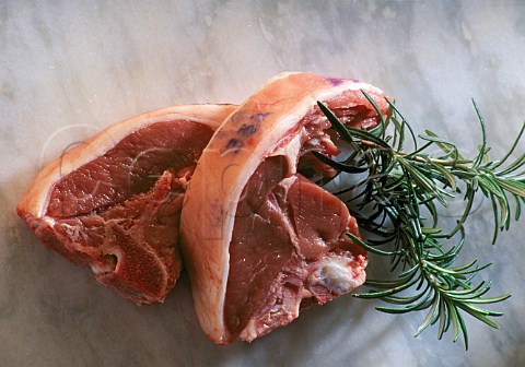 Lamb chops with a sprig of rosemary
