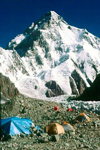 K2 with expedition tents on moraine   Pakistan