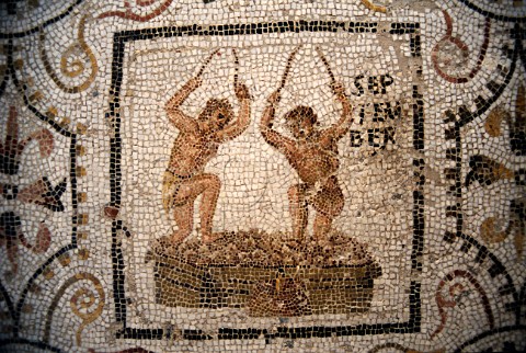 Roman mosaic showing men treading   grapes in Sousse Museum Tunisia