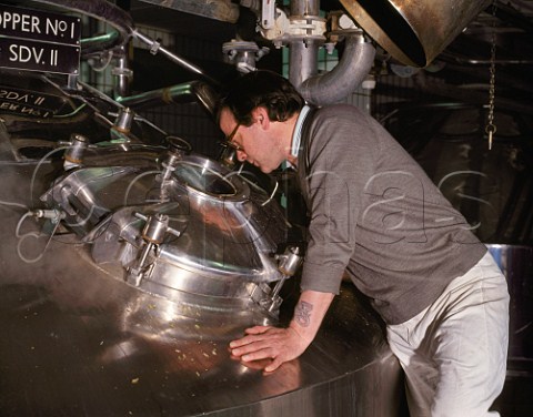 Viewing inside of brewing copper through inspection hatch cereals hops and water are mixed and boiled to form wort prior to fermentation   Youngs Ram Brewery Wandsworth London England