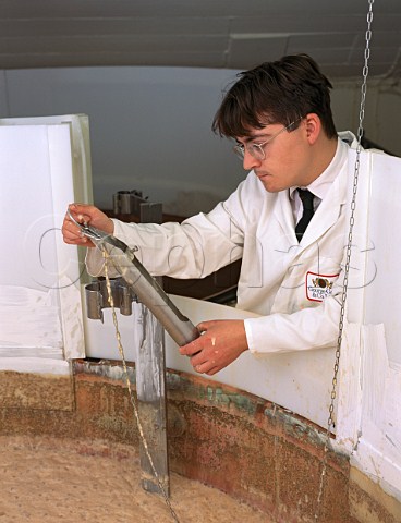 Reading temperature of a brew  prior to checking its specific gravity  in the brewery of George Gale    Co Horndean Hampshire England