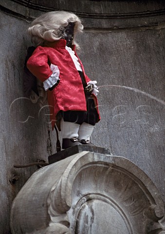 MannekenPis in one of his many costumes    here dressed as Mozart   Brussels Belgium