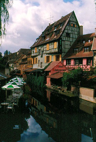 Canal lined with houses and restaurants   in Petite Venise Colmar HautRhin   France  Alsace