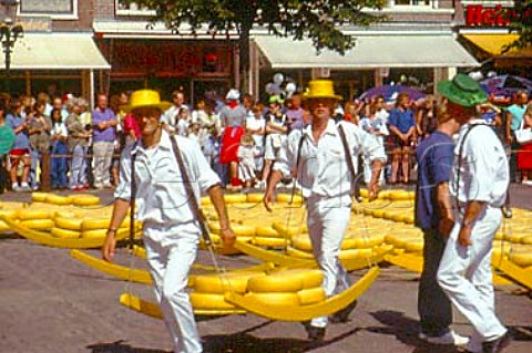 Two members of Cheese Race yellow team   set off for the Weighhouse with a load   of 125 kilos Alkmaar Netherlands