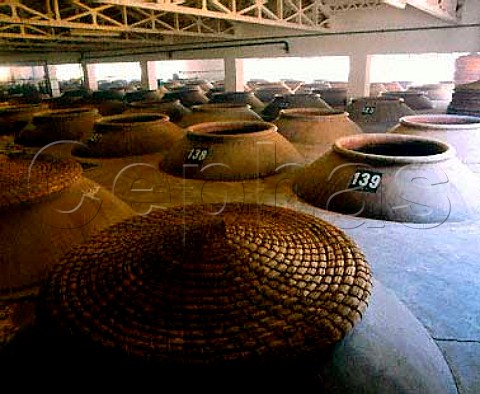 Tinajas with straw hats at Bodegas La Invencible   Valdepeas Castilla La Mancha Spain