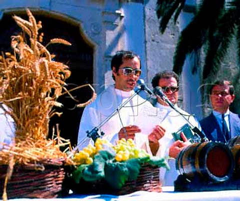Priest blessing the new wine at the   Festa das Vindimas Palmela Portugal