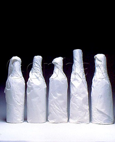 Assorted bottles wrapped in tissue paper