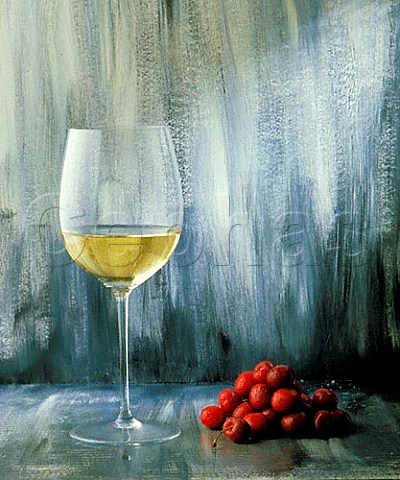 Glass of white wine and cherries