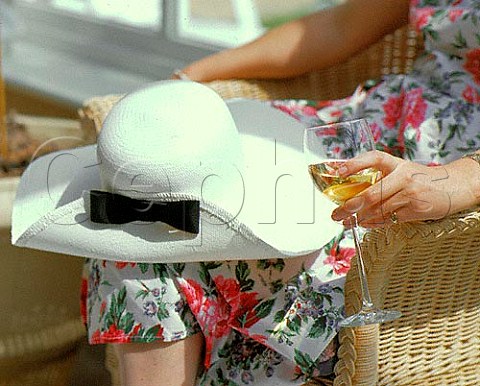 Glass of white wine with hat