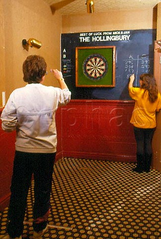 Playing darts in a pub Brighton Sussex