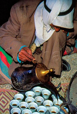 Bedouin preparing arabic coffee in  traditional style Israel