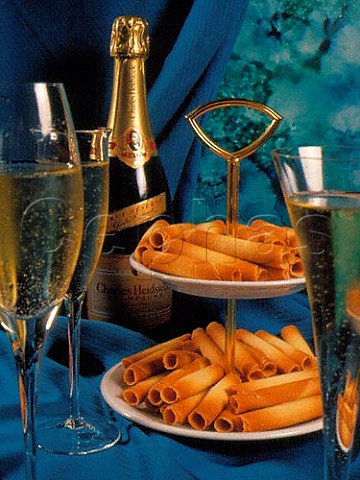 Bottle and glasses of Charles Heidsieck Brut Reserve  served with biscuits Cigars