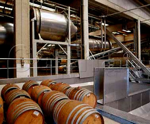 Barriques and rotary fermenters by the grape   receiving bay at Cantina Giordano  Valle Talloria dAlba Piemonte Italy