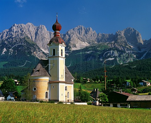 Church in village of Going with the Wilder Kaiser mountains beyond Tyrol Austria 