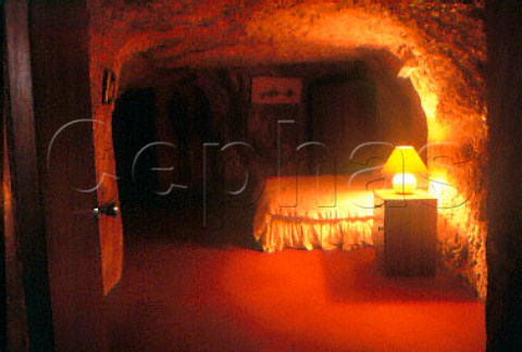 Bedroom in an underground home carved   out of the sandstone at Coober Pedy   South Australia