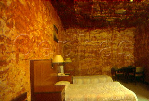 Bedroom of an underground home carved   out of the sandstone at Coober Pedy   South Australia