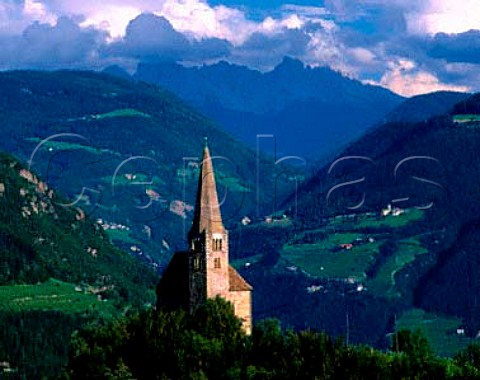 The church of San Giorgio stands high above Bolzano   amidst vineyards in the Santa Maddalena zone with   the Isarco valley and Dolomites beyond Alto Adige   Italy    Santa Maddalena DOC