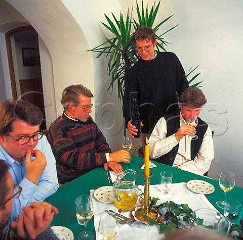Emmerich Knoll centre and friends being   served wine by his son EK junior  Unterloiben Austria  Wachau