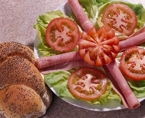 Ham lettuce and tomato salad with a seeded roll