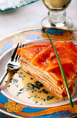 Layered salmon and cream cheese with   chive vinaigrette dressing
