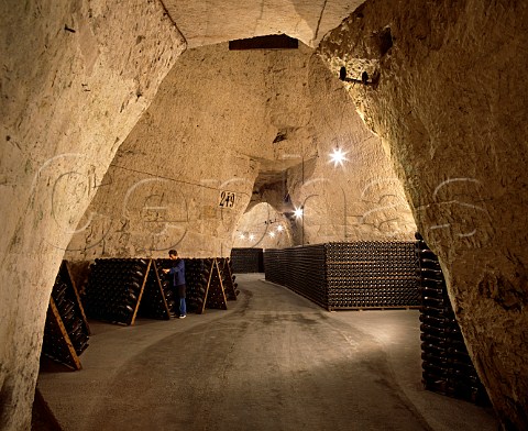 Remueur at work in the cellars of Veuve Clicquot   Ponsardin in the GalloRoman chalk quarries   crayres of Reims Marne France  Champagne