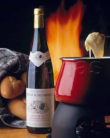 Cheese fondue with a bottle of  Schlumberger Pinot Blanc Alsace France
