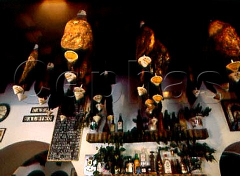 Hams hanging from the ceiling in Casa Balbino a   tapas bar on Plaza de Cabildo in the centre of   Sanlcar de Barrameda Andalucia Spain