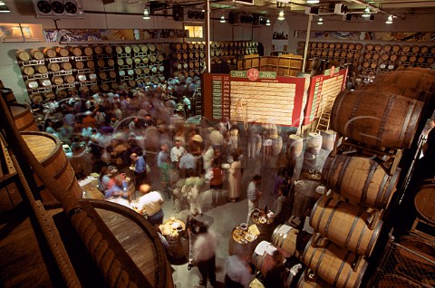 Preview tasting of lots which will be bid for in a silent auction part of Napa Valley Wine Auction for charity  In the barrel room of St Supery winery  St Helena Napa Valley California