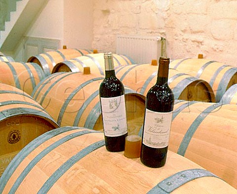 Bottles of Chteau de Valandraud and the 2nd wine   Virginie de Valandraud in the barrel chai  Stmilion Gironde France