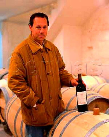 JeanLuc Thunevin with new oak barriques holding   wine undergoing the malolactic fermentation  Chteau   de Valandraud Stmilion Gironde France
