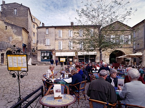 Lunchtime diners in the square of Stmilion Gironde France