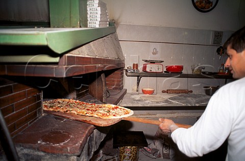 Baker Pizza making in typical pizzeria  Southern Italy