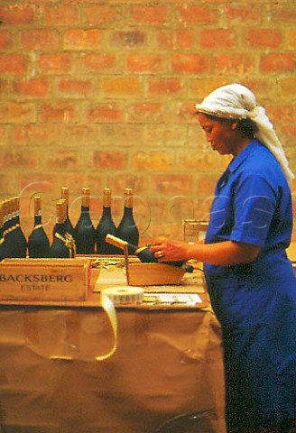Hand labelling of Brandy bottles at   Backsberg Paarl South Africa
