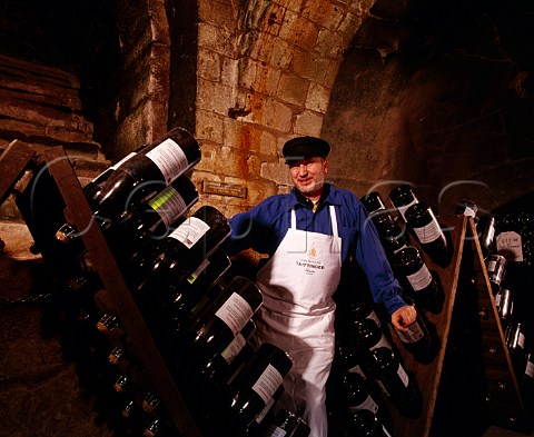 JeanPierre Girondin Chef de Caves with  Jeroboams in pupitres in the remains of the   13thcentury chapel of Saint Niaise Abbey   which form part of the cellars of   Champagne Taittinger Reims Marne France