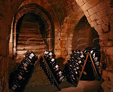 Jeroboams in pupitres in the remains of the   13thcentury chapel of Saint Niaise Abbey   which form part of the cellars of   Champagne Taittinger Reims Marne France