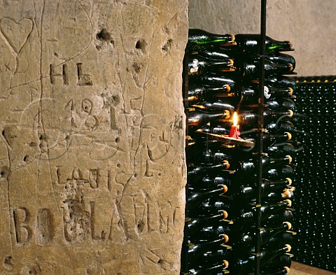 Champagne ageing sur lattes and graffiticovered wall in the cellars of Alfred Gratien Corks rather than crown caps are traditionally used by this house for the second fermentation  pernay Marne France 