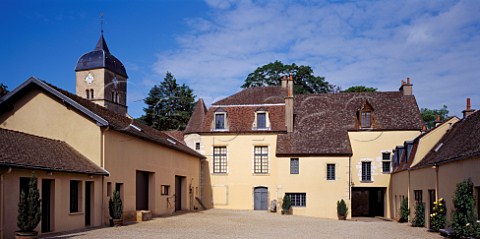 Courtyard of Domaine Comte Georges de Vog overlooked by the village church which was built by his ancestors  ChambolleMusigny Cte dOr France