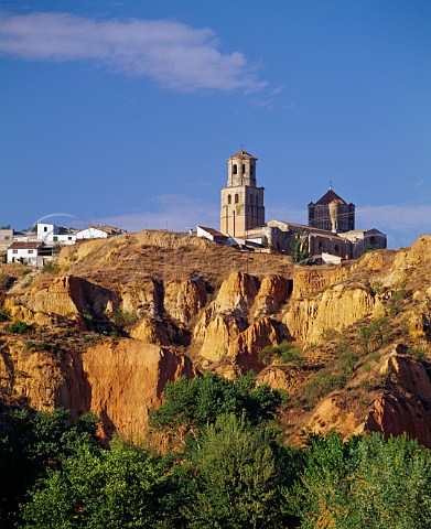The 12thcentury Colegiata de Santa Maria la Mayor stands on a cliff above the Duero River in the ancient wine town of Toro   Castilla y Len Spain