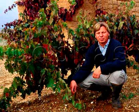 Peter Sisseck with 60year old Tinto Fino vine in   one of the vineyards of Dominio de Pingus at   La Horra Castilla y Len Spain   DO Ribera del Duero