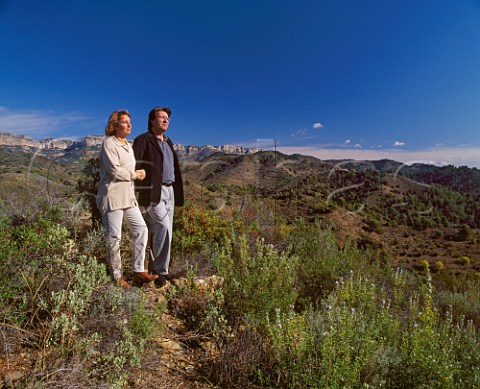 Carles Pastrana and his wife Mariona Jarque on their Mas den Bruno estate with the Sierra de Montsant in the distance Wines made from here are Miserere Garnacha Cabernet Sauvignon Tempranillo Merlot Cariena and Kyrie Xarello Moscatel Garnacha Blanca   Costers del Siurana Gratallops Catalonia Spain    Priorato