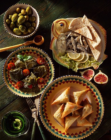Whitebait with pitta bread Dolmades Stuffed vine   leaves Tiropittakia  Cheese triangles and olives