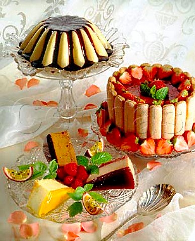 Desserts Crme Caramel and Strawberry Torte with   slices of lemon raspberry and passion fruit torte