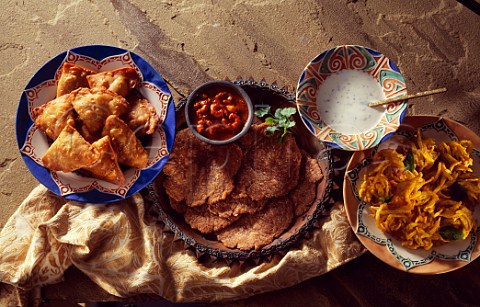 Prawn Prawn curry with onion bhaji samosas and  raita