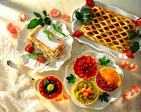 Desserts Plum lattice strawberry millefeuille and   assorted fruit tartlets