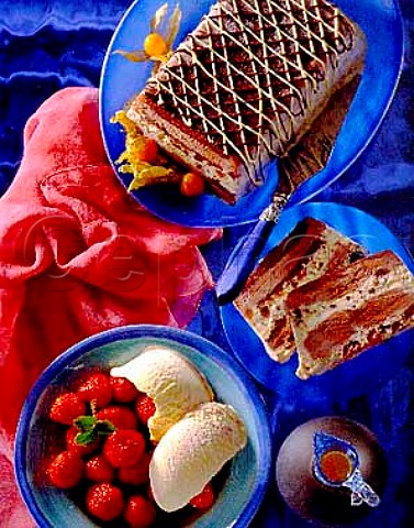 Dessert Black forest icecream gteaux and  strawberries with strawberry ripple icecream