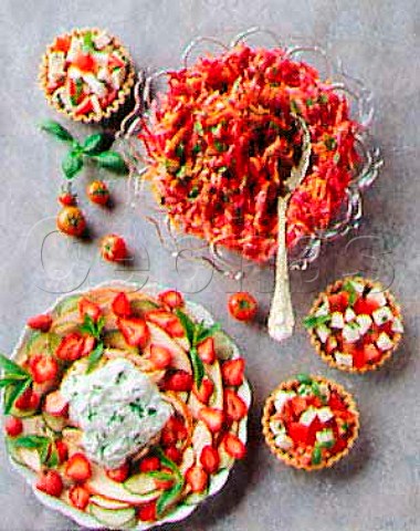 Grated raw vegetables with garlic dressing smoked   chicken mint and strawberry salad and tomato basil   and mozzarella tartlets