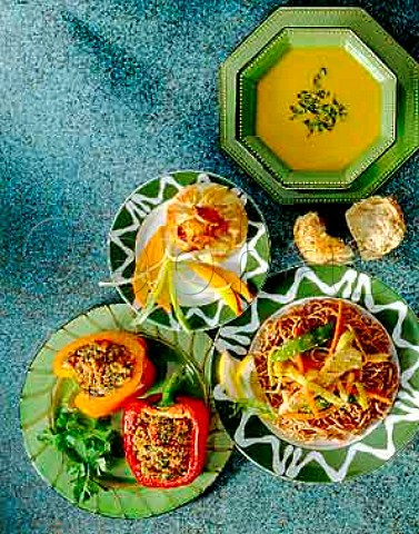 Vegetarian Carrot soup wholemeal spaghetti with  stirfried vegetables stuffed peppers filo pastry  parcel with mango and spring onion garnish