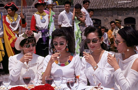 Women drinking wine on The Great Wall  Beijing China